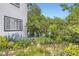 Serene garden featuring a white bench and various flowering plants at 947 S Yates St, Denver, CO 80219