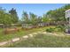 Landscaped backyard with raised garden beds and stone pathways at 947 S Yates St, Denver, CO 80219