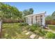 Charming greenhouse with stepping stones surrounded by flowers at 947 S Yates St, Denver, CO 80219
