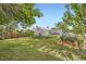 Charming greenhouse surrounded by lush landscaping and vibrant greenery at 947 S Yates St, Denver, CO 80219