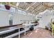 Greenhouse area featuring a sink and workspace beneath string lights at 947 S Yates St, Denver, CO 80219
