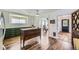 Kitchen area featuring custom wood floors and green kitchen island at 947 S Yates St, Denver, CO 80219