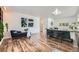 Open living room with wood floors, stylish decor, and ample natural light at 947 S Yates St, Denver, CO 80219