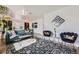 Comfortable living room with stylish seating, modern decor, and a cozy rug at 947 S Yates St, Denver, CO 80219