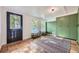 Mud room with storage, bright windows, and a durable tile floor at 947 S Yates St, Denver, CO 80219