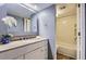 This bathroom offers ample vanity space, granite countertops, and a shower with a tub at 7665 E Eastman Ave # 210, Denver, CO 80231