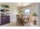 Dining room featuring a wooden table, chairs, and decorative lighting at 7665 E Eastman Ave # 210, Denver, CO 80231