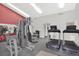 Well-equipped gym features modern exercise equipment and a mirrored wall for a complete workout experience at 7665 E Eastman Ave # 210, Denver, CO 80231