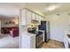 Well-lit kitchen with essential appliances and open layout at 7665 E Eastman Ave # 210, Denver, CO 80231