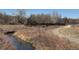 Natural landscape featuring a walking path and a bridge crossing a stream, inviting outdoor adventures at 7665 E Eastman Ave # 210, Denver, CO 80231