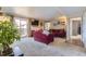 Open living room with fireplace and sliding glass door at 7665 E Eastman Ave # 210, Denver, CO 80231