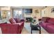 Living room features comfortable seating, fireplace, and bright light at 7665 E Eastman Ave # 210, Denver, CO 80231