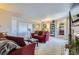Inviting living room with plush red sofas and neutral carpet at 7665 E Eastman Ave # 210, Denver, CO 80231