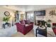 Comfortable living room with a fireplace and large TV at 7665 E Eastman Ave # 210, Denver, CO 80231