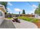 Spacious backyard features a stamped concrete patio, lawn, shed, playground set and garden at 1253 Uinta St, Denver, CO 80220