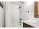 Updated bathroom features classic subway tile, a modern vanity, and sleek fixtures at 1253 Uinta St, Denver, CO 80220