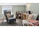 Inviting room with comfortable seating, modern shelving, and abundant natural light from a large window at 1253 Uinta St, Denver, CO 80220