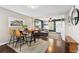Stylish dining area with hardwood floors, views into the living room, and seating for four at 1253 Uinta St, Denver, CO 80220