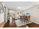 Bright dining area with hardwood floors, French doors, and an open view into the kitchen at 1253 Uinta St, Denver, CO 80220