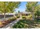 Beautiful home with mature trees, manicured landscaping and a cozy front porch at 1253 Uinta St, Denver, CO 80220