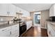 Well-lit kitchen featuring granite countertops, stainless steel appliances, and an open layout at 1253 Uinta St, Denver, CO 80220