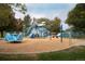 A colorful, modern playground featuring slides, swings, and climbing structures at 1253 Uinta St, Denver, CO 80220