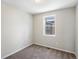 Empty bedroom with carpet and a window with an exterior view at 3654 Penang Dr, Castle Rock, CO 80109
