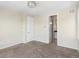 Neutral bedroom featuring carpet, multiple windows, and access to an en-suite bathroom at 3654 Penang Dr, Castle Rock, CO 80109