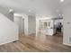 Open-concept living space with hardwood floors flowing into modern kitchen at 3654 Penang Dr, Castle Rock, CO 80109