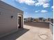 Spacious roof deck with door access and views of the neighborhood under a sunny sky at 3654 Penang Dr, Castle Rock, CO 80109