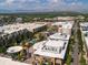 Aerial view of city buildings, green landscape, and distant mountains provides a vibrant, walkable community at 453 S Quay Street, Lakewood, CO 80226