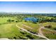 Aerial view of a green space with a pond and winding walking trails at 453 S Quay Street, Lakewood, CO 80226