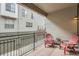 Relaxing balcony with two chairs and a small table, perfect for enjoying the outdoors at 453 S Quay Street, Lakewood, CO 80226