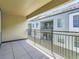 View from balcony overlooking neighborhood, with metal railing and neutral-colored siding at 453 S Quay Street, Lakewood, CO 80226