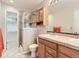 Well-appointed bathroom with shower, vanity, mirror and convenient storage at 453 S Quay Street, Lakewood, CO 80226