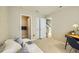 Bedroom featuring a daybed, ensuite bath, and an open door with access to carpeted stairs at 453 S Quay Street, Lakewood, CO 80226