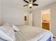 Cozy bedroom featuring a ceiling fan and ensuite bathroom at 453 S Quay Street, Lakewood, CO 80226