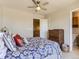 Bedroom featuring neutral colors, a ceiling fan and an ensuite bathroom at 453 S Quay Street, Lakewood, CO 80226