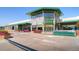 Exterior of Whole Foods Market, featuring large windows, flowers, and pedestrian walkway at 453 S Quay Street, Lakewood, CO 80226