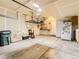 Spacious garage with plenty of storage, utility sink, and overhead lighting at 453 S Quay Street, Lakewood, CO 80226