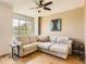 Bright living room featuring a large window with a view and comfortable sectional sofa at 453 S Quay Street, Lakewood, CO 80226