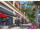 Restaurant row along sidewalk featuring outdoor seating with umbrellas and awnings at 453 S Quay Street, Lakewood, CO 80226