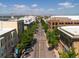 Aerial street view of a city thoroughfare lined with trees and buildings under a clear sky at 453 S Quay Street, Lakewood, CO 80226