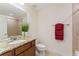 Clean bathroom featuring granite countertop, under-mount sink, and tiled shower at 671 Robert St, Longmont, CO 80503
