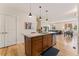 Stylish kitchen island with a sink, stainless steel dishwasher, and pendant lighting at 671 Robert St, Longmont, CO 80503