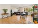 Spacious living room with hardwood floors, large windows, and comfortable seating at 671 Robert St, Longmont, CO 80503