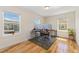 Bright home office with hardwood floors and large windows providing lots of natural light at 671 Robert St, Longmont, CO 80503