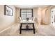 Inviting dining area with a modern table, comfortable seating, and a charming window view at 12185 S Grass River Trl, Parker, CO 80134