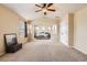 Spacious main bedroom with vaulted ceilings, neutral tones, and ample natural light through the windows at 12185 S Grass River Trl, Parker, CO 80134