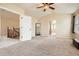 Large main bedroom with high ceilings and natural light leading to the ensuite bathroom at 12185 S Grass River Trl, Parker, CO 80134